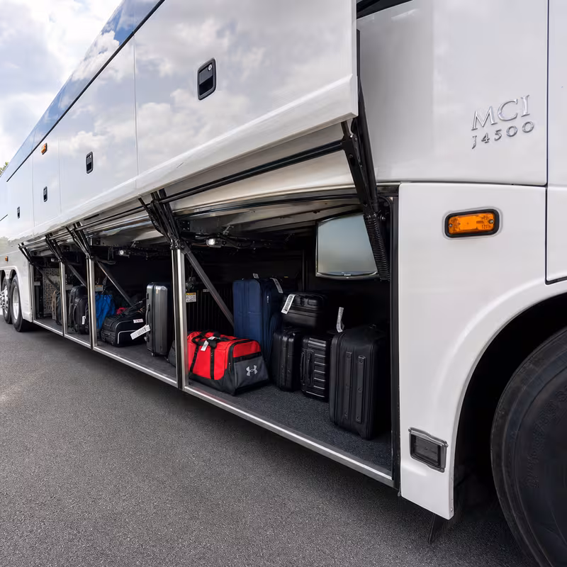 Party bus interior with wraparound leather seating and LED lighting in Overland Park