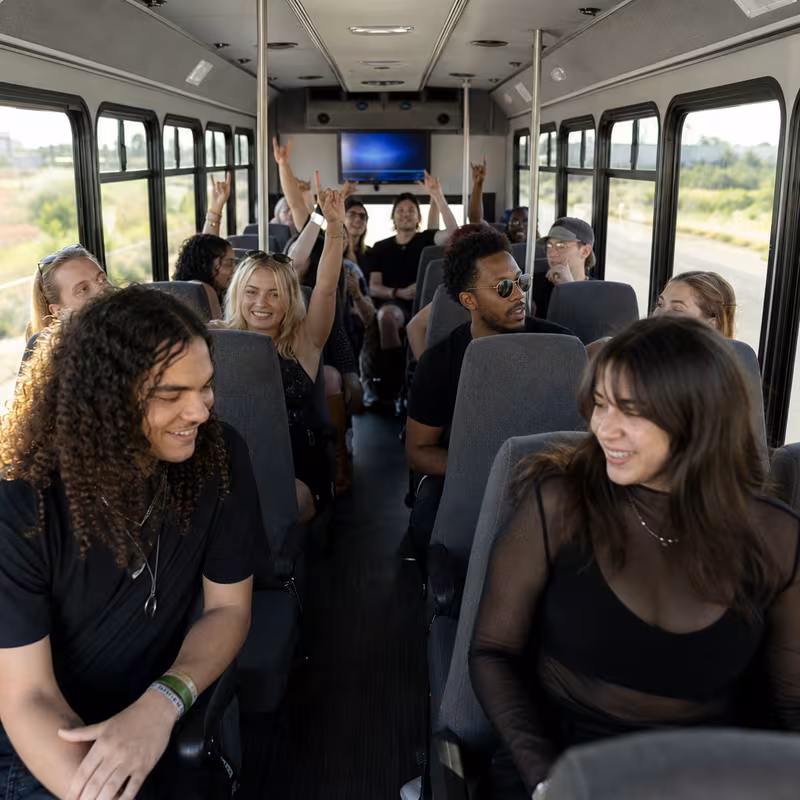 Party bus interior with wraparound leather seating and LED lighting in Overland Park