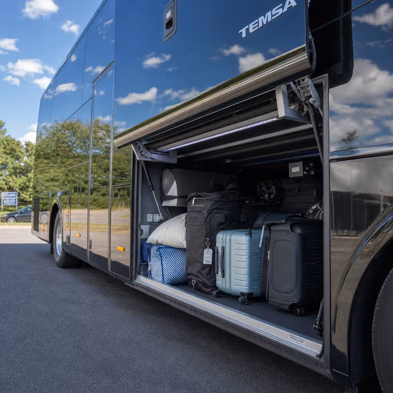 Party bus interior with wraparound leather seating and LED lighting in Overland Park