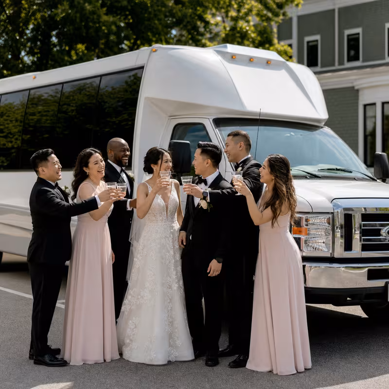 Passengers loading luggage while boarding an Overland Park group shuttle